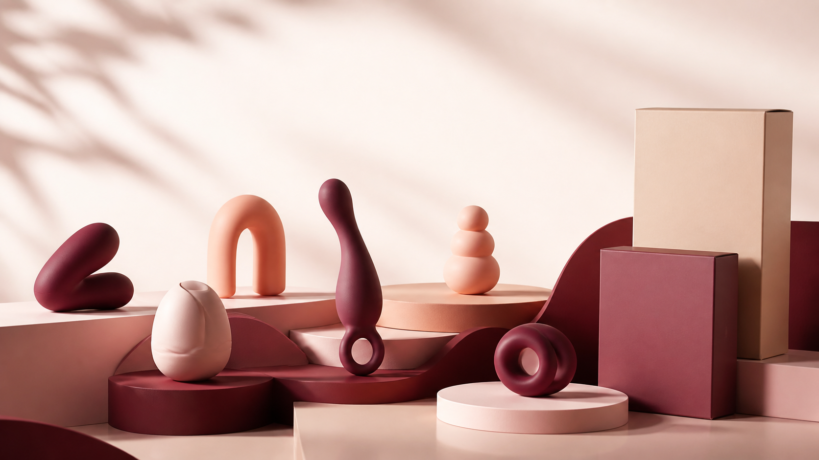 Sculptural intimate wellness objects arranged on warm color blocks